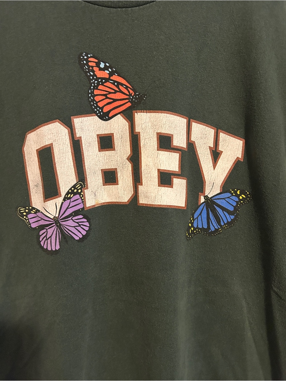 ObeyDark Green Tee with Cream Logo and Colorful Butterflies